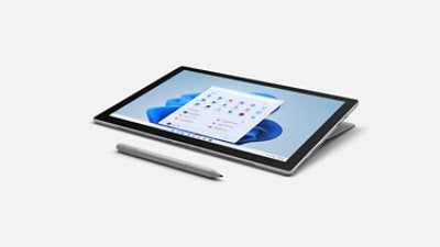 Microsoft Surface Pen in Platinum resting beside a Surface Pro 7