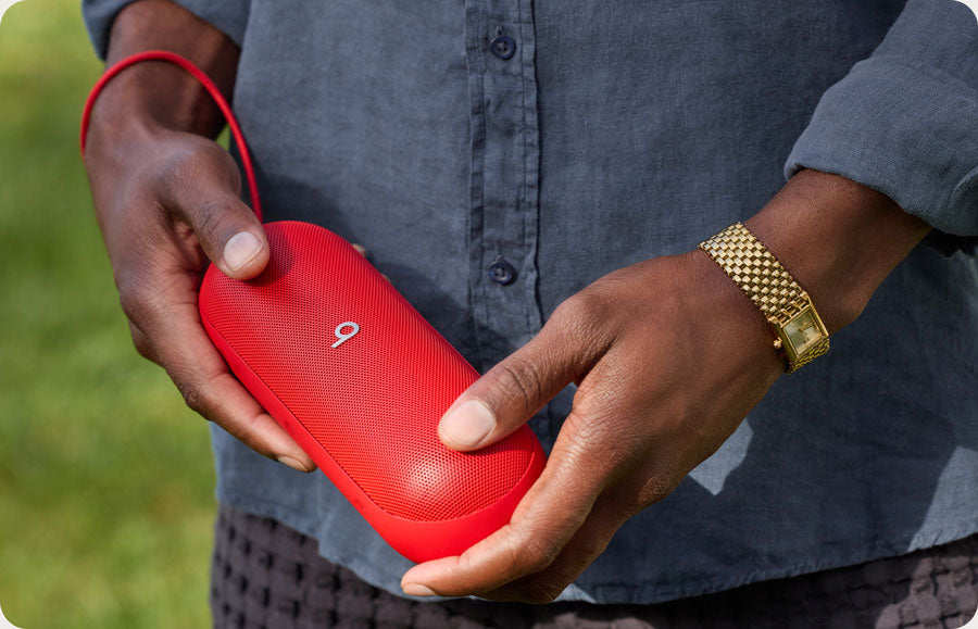 Person holding the Beats Pill portable speaker