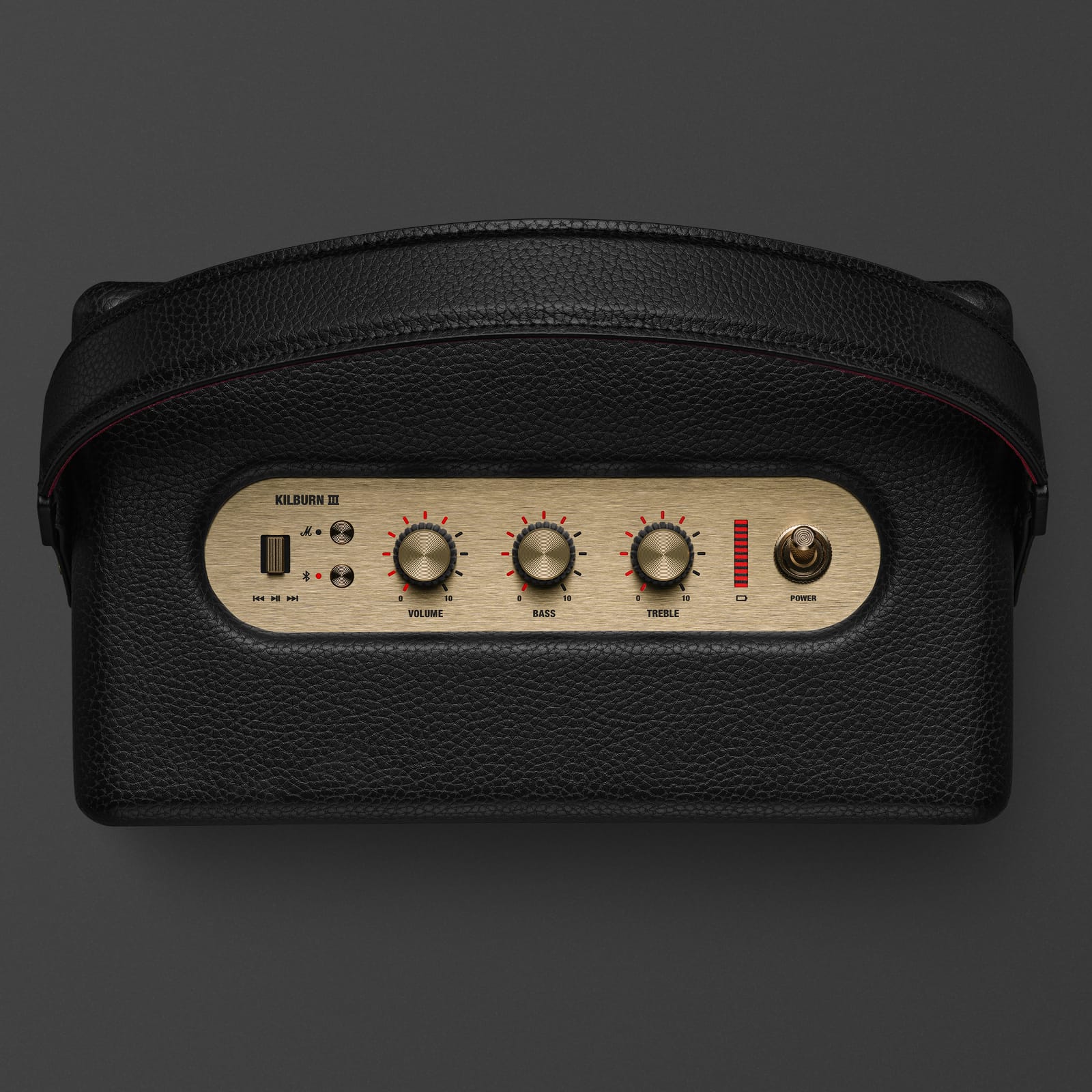 Marshall Kilburn III Black and Brass speaker being carried by handle