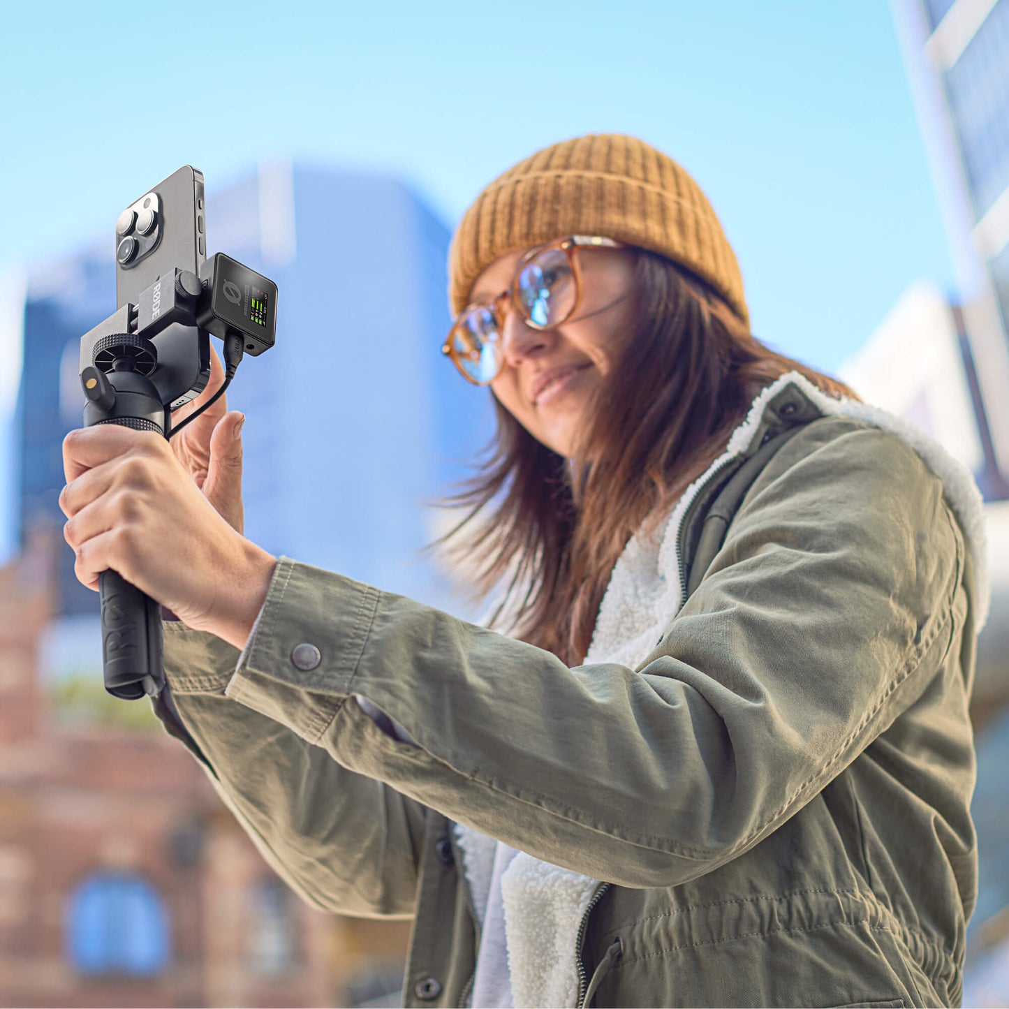 Vlogger using RODE Wireless PRO with iPhone on tripod
