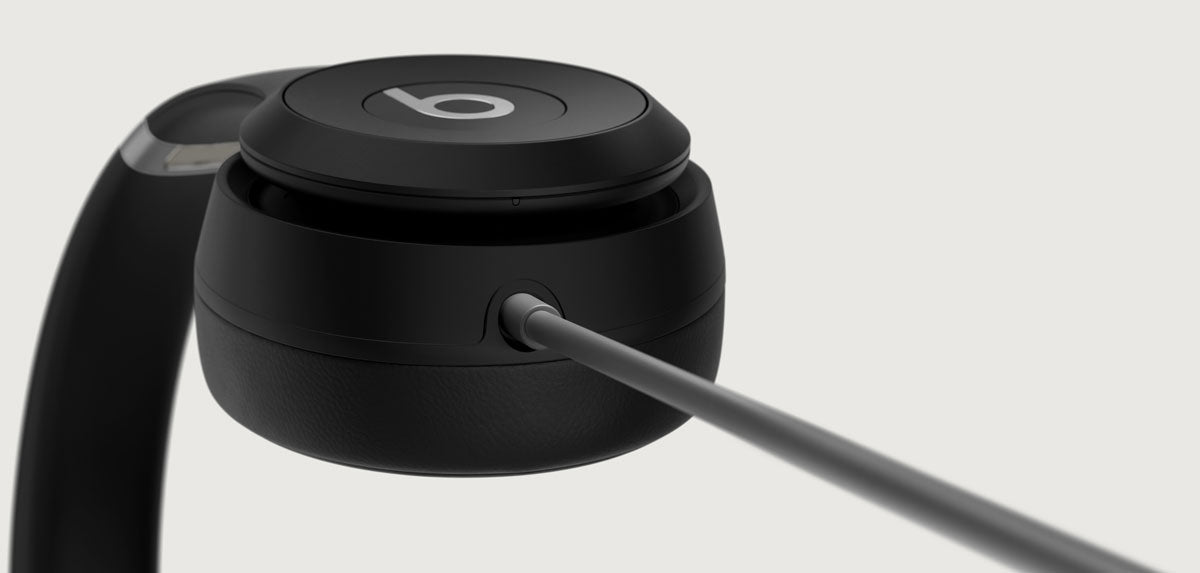 Close up of Beats Solo 4 headphones with USB-C charging cable