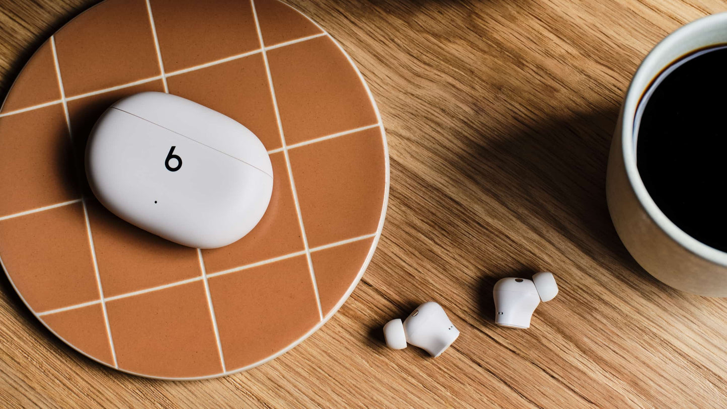 Beats Studio Buds Plus charging case and earbuds in Ivory